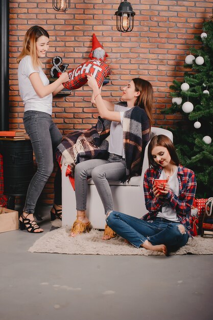 Girls near Christmas tree