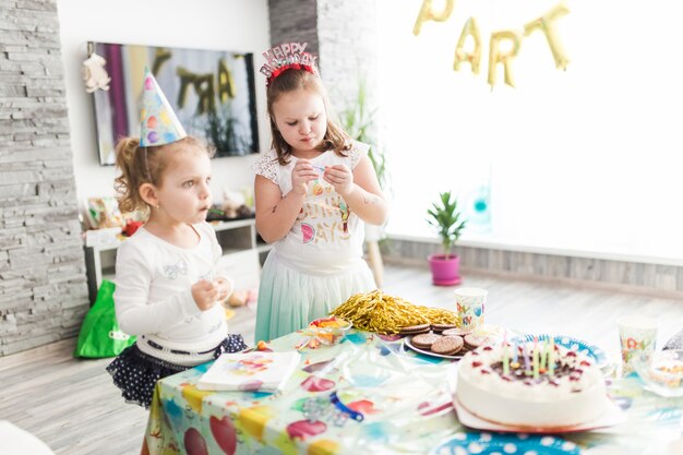 Girls near table with treats