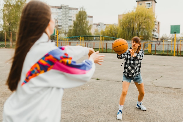 Girls passing basketball