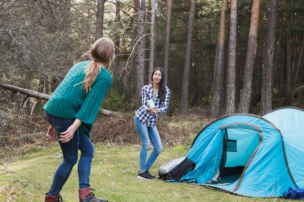 Girls playing next to the tent