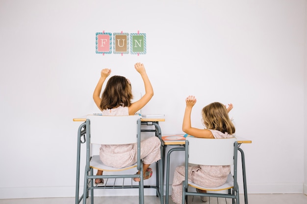 Free photo girls rejoicing in finished homework