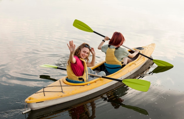 Girls rowing in kayak