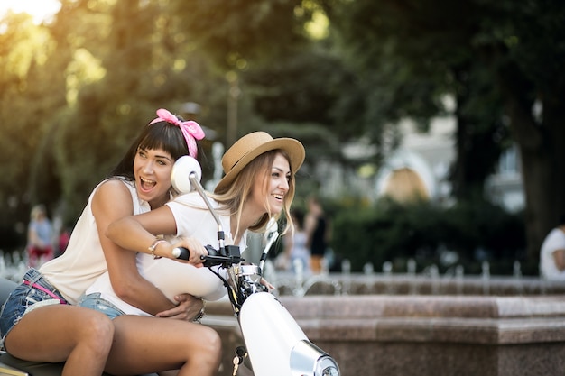 Free Photo girls on scooter