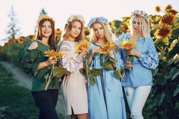 Free photo girls and sunflowers