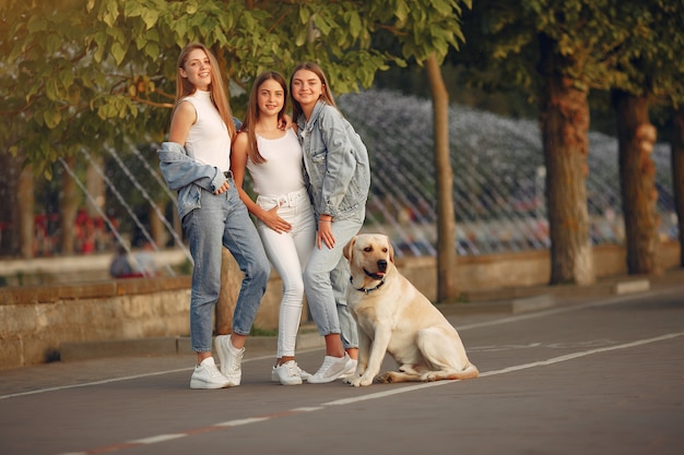 Girls walking in a spring city with cute dog