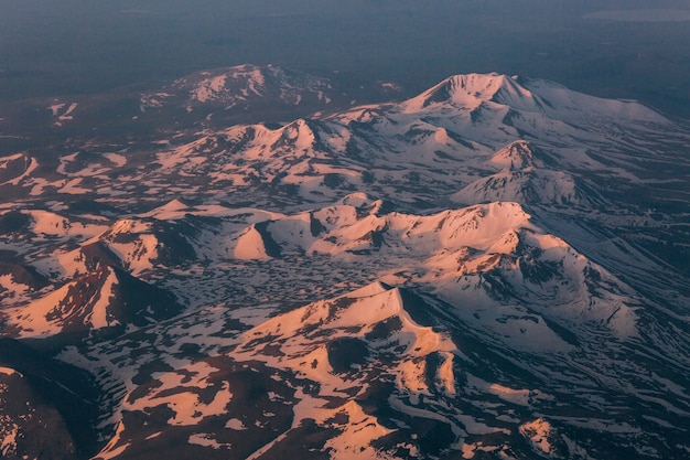 Glaciers on the top of the mountains relief with light and shadow