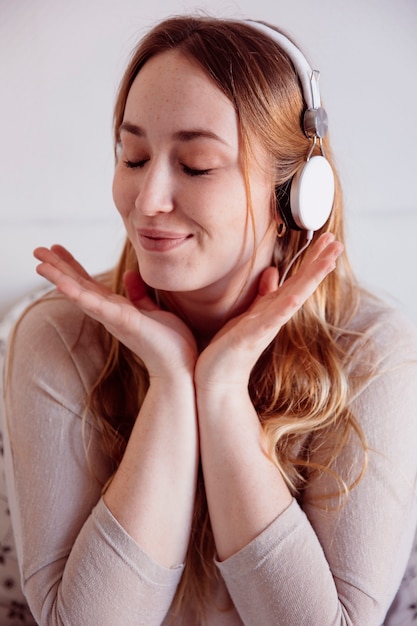 Glad woman listening to music