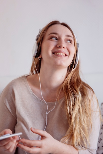 Glad woman listening to music