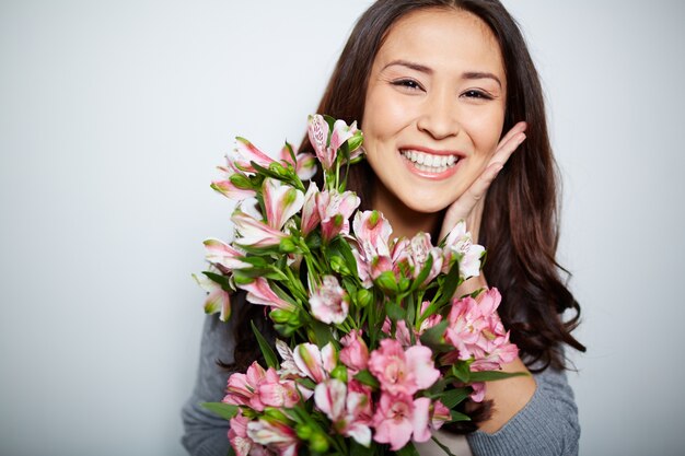 Glad woman with flowers