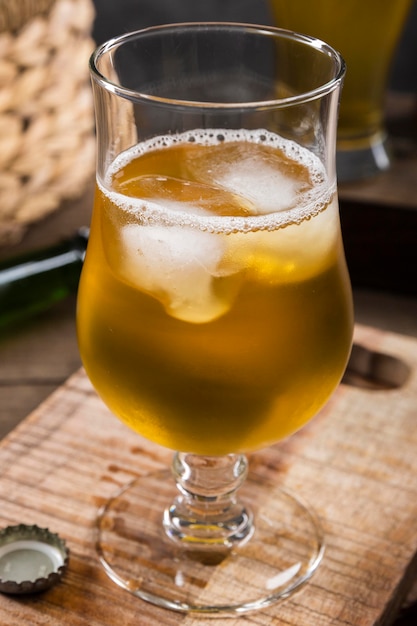 Free photo glass of beer with ice cubes