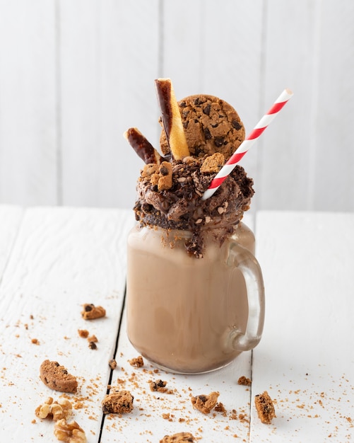 Glass of chocolate shake on table