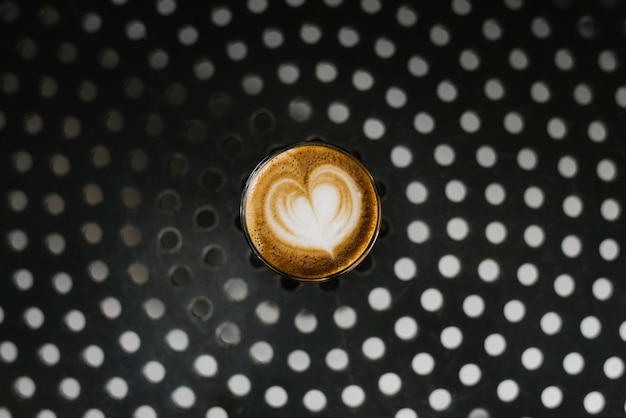 A glass of coffee on a table