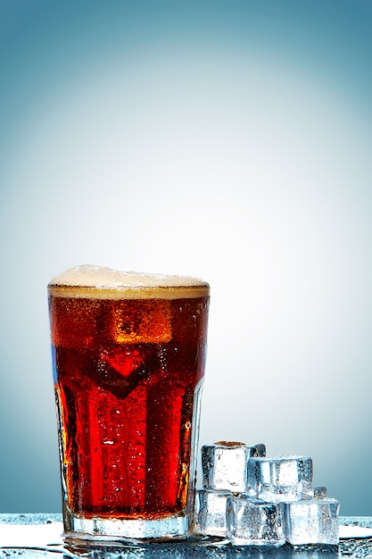 Glass of cola with ice cubes