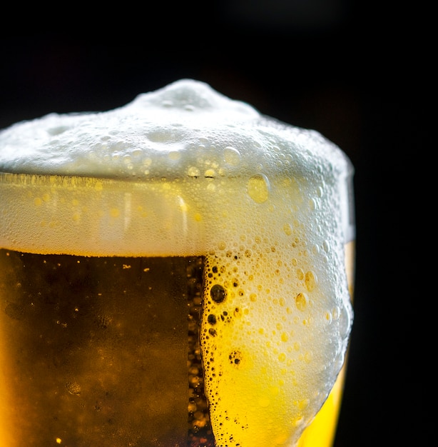 Free Photo a glass of cold beer macro photography