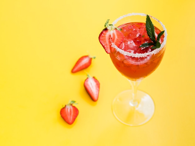 Free photo glass of drink with strawberries and salt