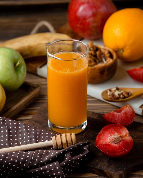 Glass of fresh juice with fruits