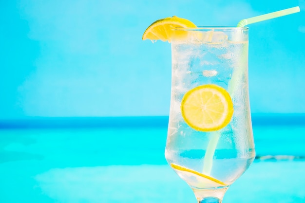 Free Photo glass of frozen drink with sliced lemon and straw