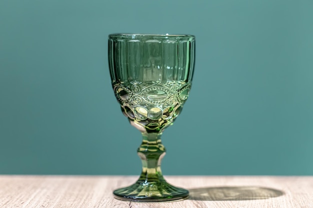 Free photo glass green textured goblet on a blue background