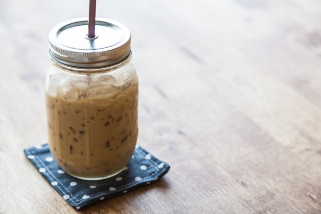 Glass jar with iced coffee