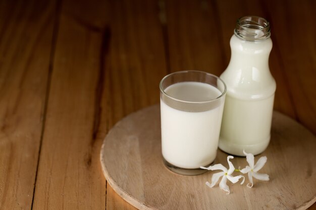 Glass of milk and a bottle of fresh milk