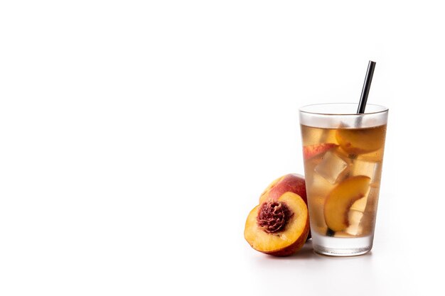 Glass of peach tea with ice cubes isolated on white background