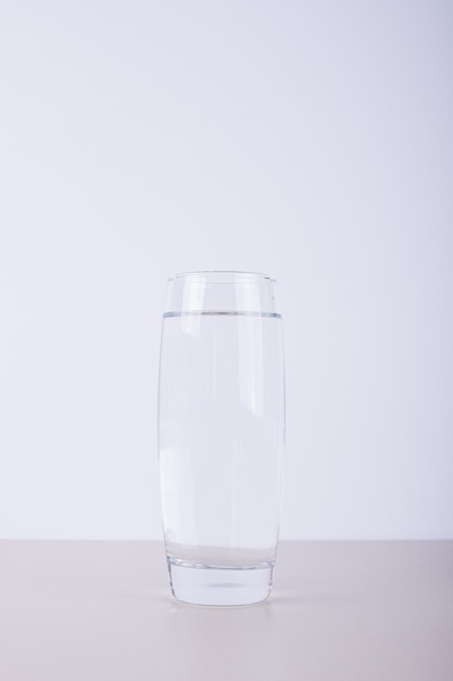 Free photo glass of pure water on white.