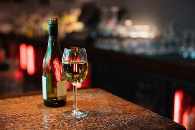 Glass of red wine on bar counter