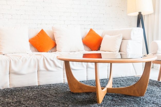 Glass table and couch with cushions