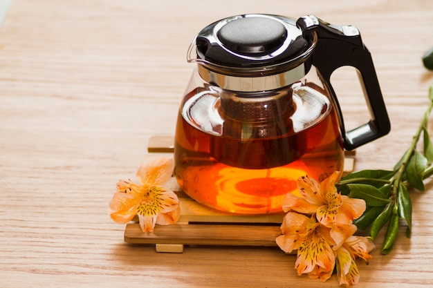 Free Photo glass teapot with flowers