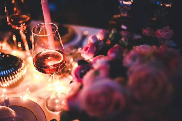 Free photo glass of wine on a decorated table