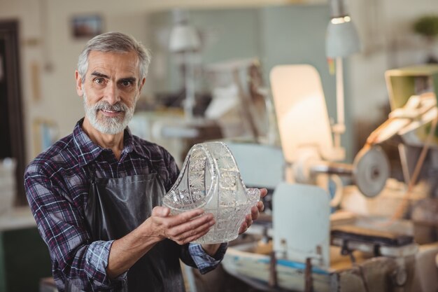 Glassblower holding glassware