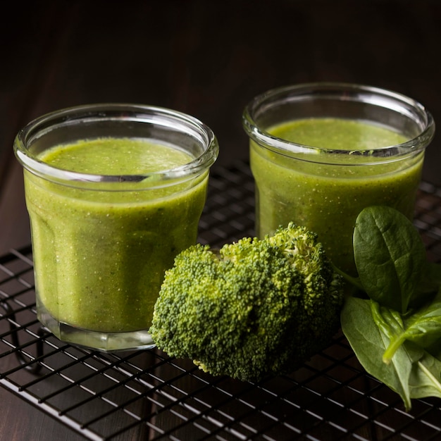 Glasses of broccoli and spinach smoothies