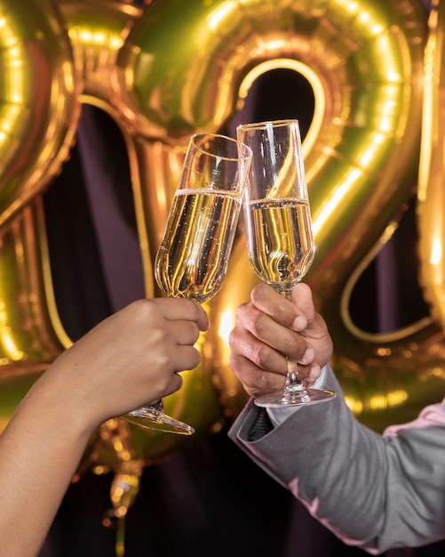 Glasses of champagne being held in hands