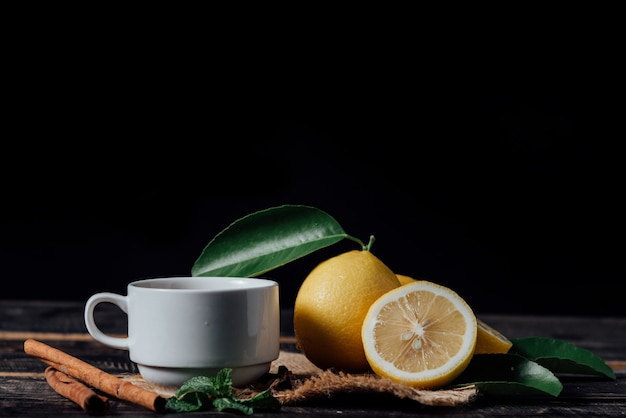 Glasses of  tea with lemon,Sliced lemons on a chopping board