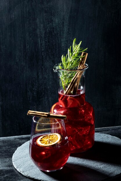 Glasses with fruity drinks on table