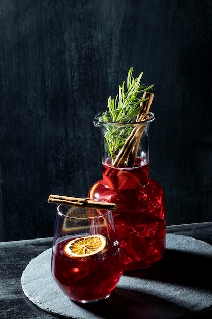 Glasses with fruity drinks on table