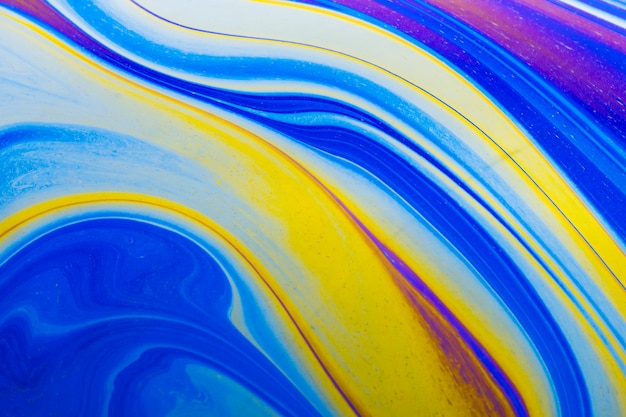 Free photo gleaming wavy blue and yellow abstract background