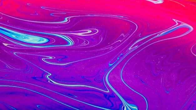 Gleaming wavy pink and purple abstract background