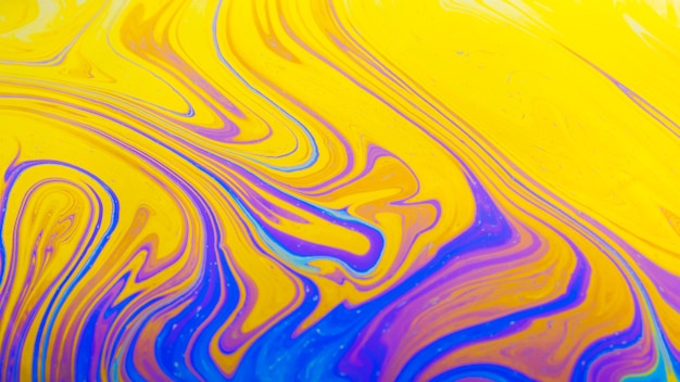 Glimmering wavy purple and yellow abstract background