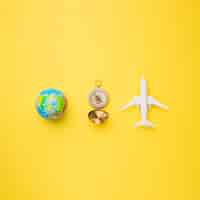 Free photo globe, compass and toy plane