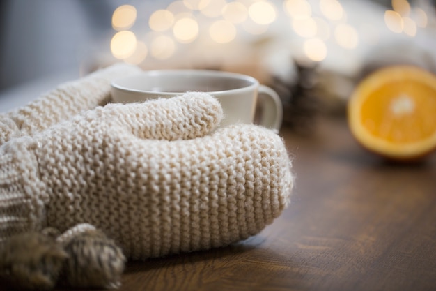 Free Photo gloves touching tea