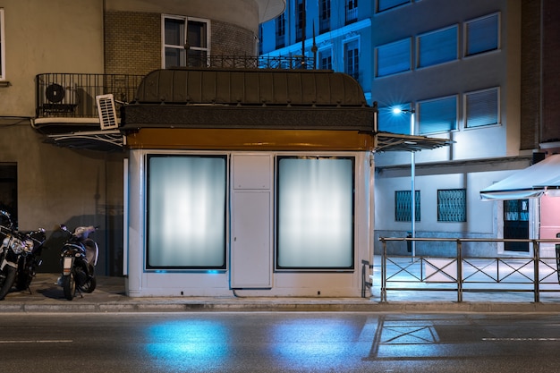 Glowing billboard for advertisement on the wall near the street