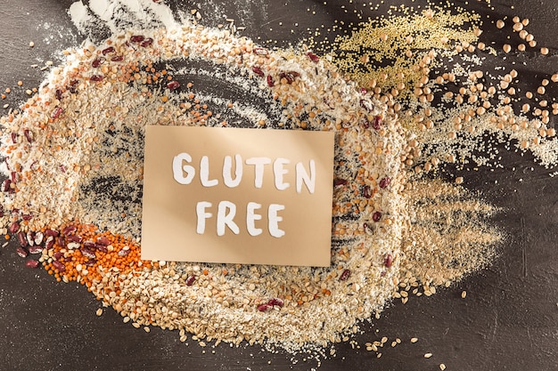 Free Photo gluten free flour and cereals millet, quinoa, corn bread, brown buckwheat, rice with text gluten free