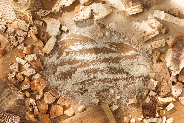 Gluten free food. Various pasta, bread and snacks on wooden background from top view