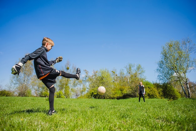 Goalkeeper hitting the ball