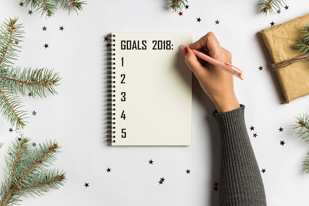 Goals plans dreams make to do list for new year christmas concept writing