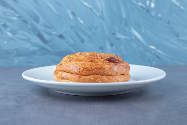 Gogal traditional Azerbaijani cookie on a plate on marble table.