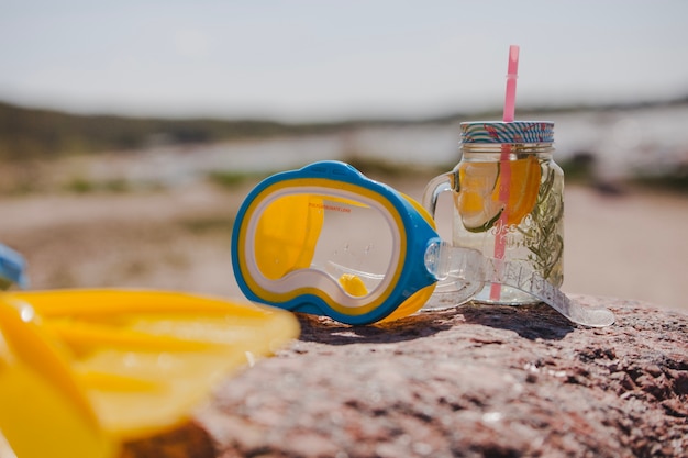 Free photo goggles with flippers and refreshing drink