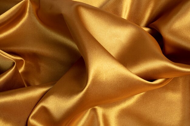 Gold aesthetic wallpaper with cloth top view