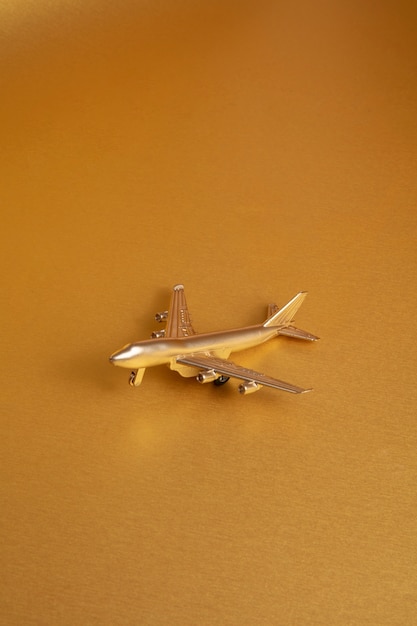 Gold aesthetic wallpaper with plane high angle